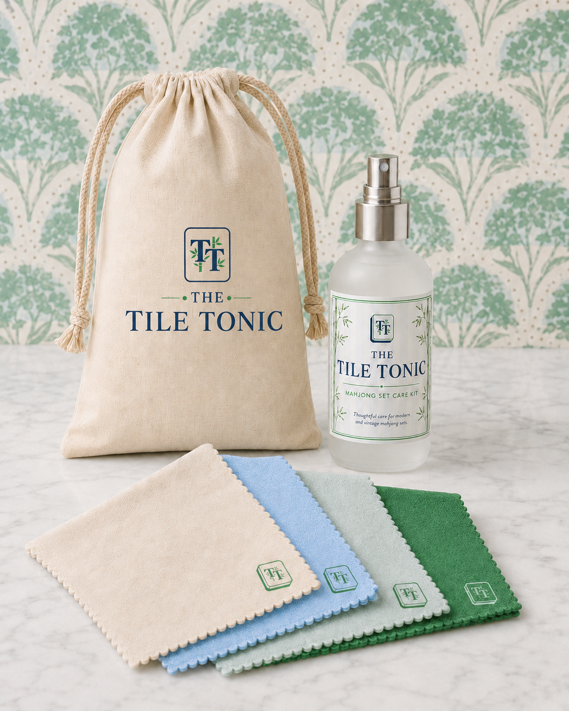 The Tile Tonic Mahjong Set Care Kit — canvas pouch, spray bottle, and four microfiber care cloths